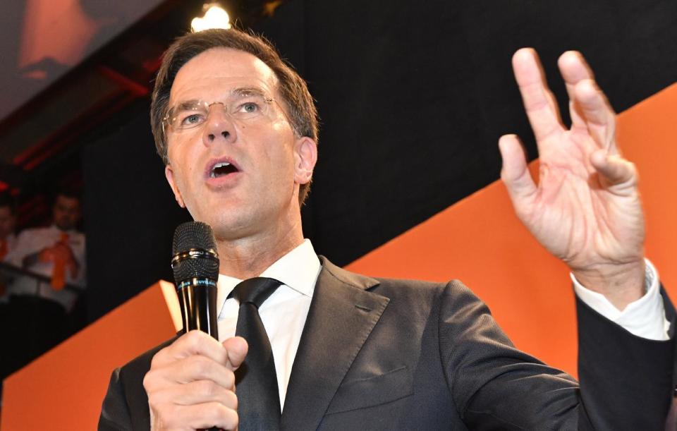 Prime Minister Mark Rutte of the free-market VVD party speaks to his supporters after exit poll results of the parliamentary elections were announced in The Hague, Netherlands, Wednesday, March 15, 2017. (AP Photo/Patrick Post)