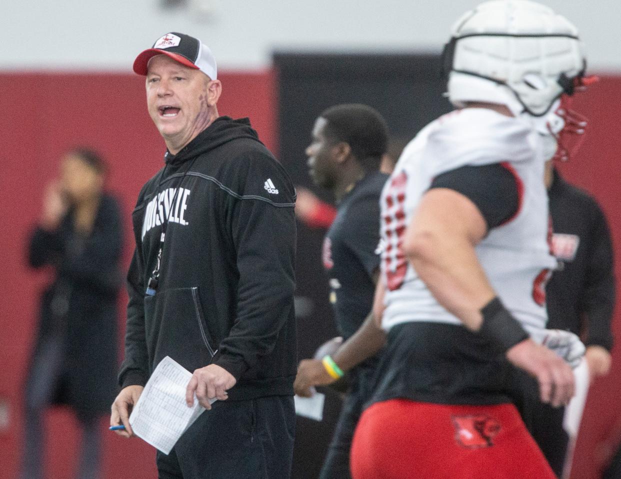 Louisville head football coach Jeff Brohm oversees practice April 12 ahead of the Red-White scrimmage game.