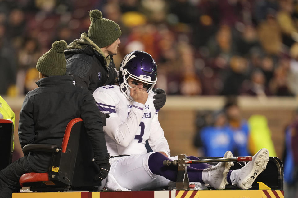 Northwestern quarterback Ryan Hilinski (3) is carted off the field after sustaining an injury during the second half of an NCAA college football game against Minnesota Saturday, Nov. 12, 2022, in Minneapolis. (AP Photo/Abbie Parr)