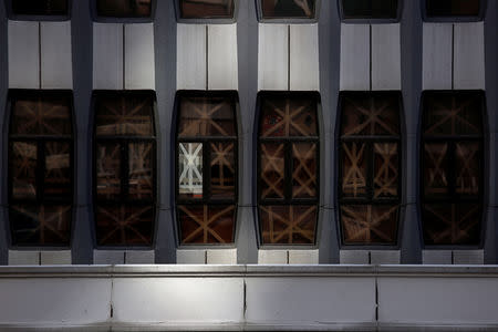 Windows are taped at a commercial building at the financial Central district as as Typhoon Mangkhut approaches Hong Kong, China September 15, 2018. REUTRERS/Bobby Yip