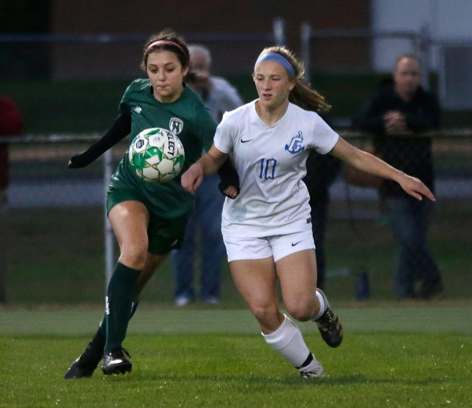 The Sentinels' Avery Areson and the Clippers' Emma Kucal follow the bouncing ball during in girls soccer action on Oct 19, 2021 between the Smithfield Sentinels and the undefeated Cumberland Clippers at Smithfield.  