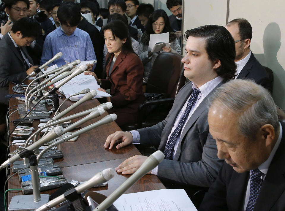 FILE - In this Feb. 28, 2014 file photo, Mt. Gox CEO Mark Karpeles, sitting at second right, attends a press conference at the Justice Ministry in Tokyo. The Tokyo bitcoin exchange Mt. Gox that filed for bankruptcy protection blamed theft through hacking for its losses Monday, March 3, 2014, and said it was looking into a criminal complaint.(AP Photo/Kyodo News, File) JAPAN OUT, MANDATORY CREDIT