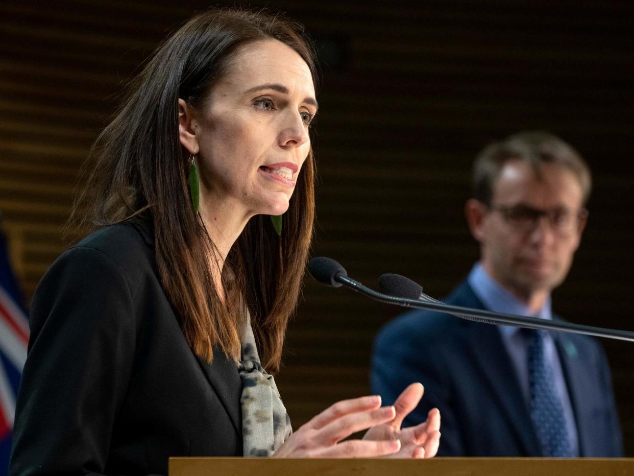 Jacinda Ardern, alongside health chief Ashley Bloomfield, updates the public on the situation: AP