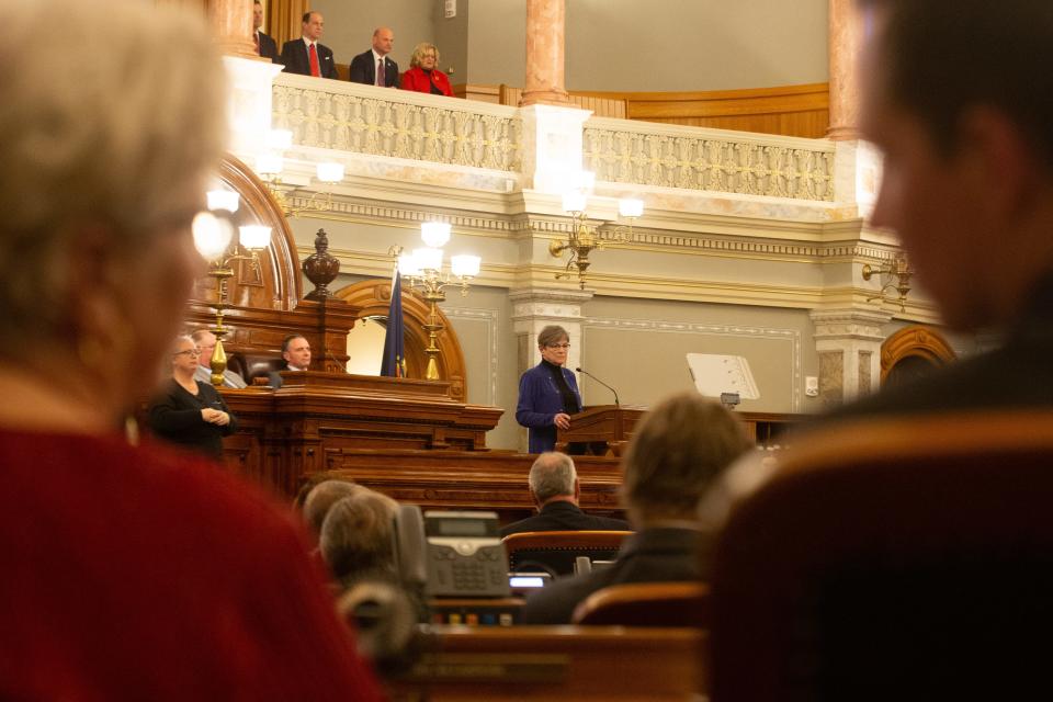 Republican legislative members frame Gov. Laura Kelly as they make remarks during her State of the State address Tuesday evening.