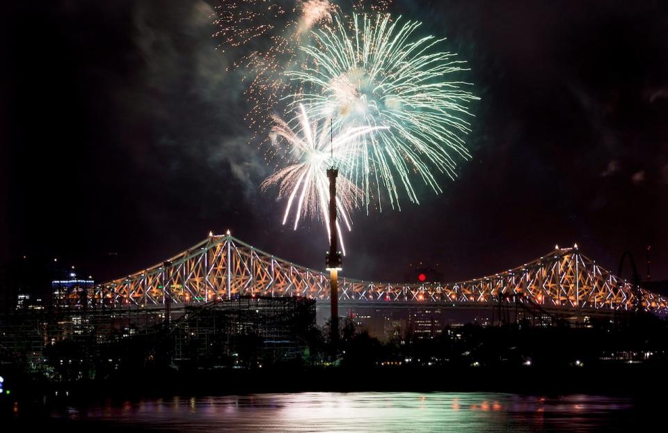 Fireworks explode over an illuminated Jacques Cartier Bridge in Montreal Wednesday, night to celebrate the city's 375th birthday.