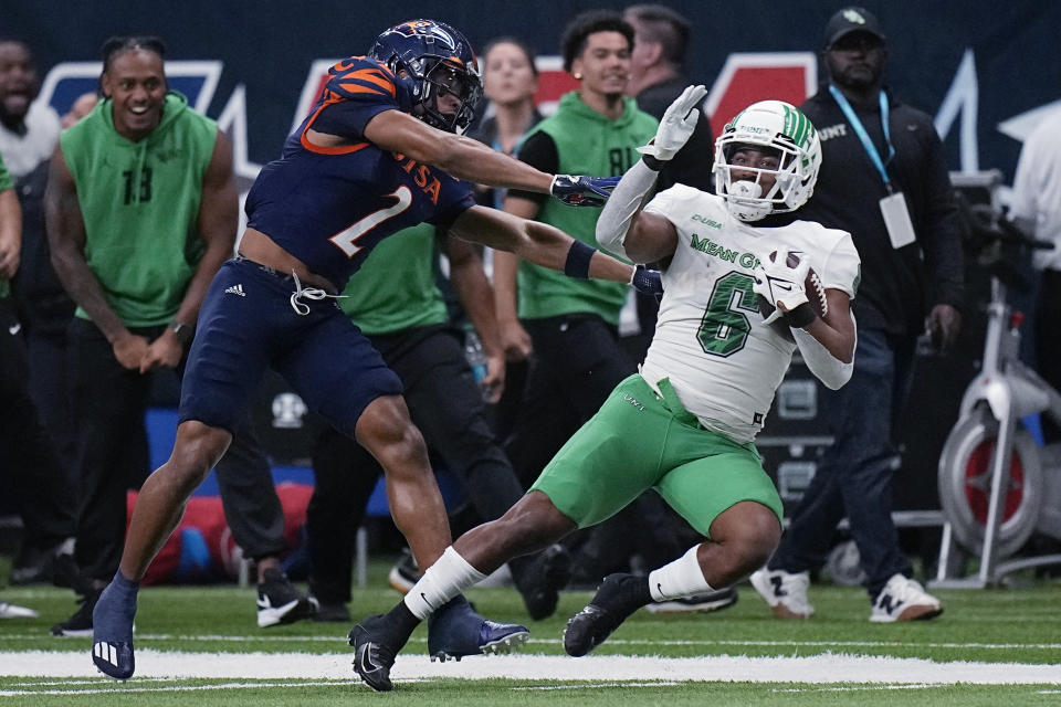 North Texas running back Ikaika Ragsdale (6) is stopped by UTSA cornerback Corey Mayfield Jr. (2) during the first half of an NCAA college football game for the Conference USA championship in San Antonio, Friday, Dec. 2, 2022. (AP Photo/Eric Gay)