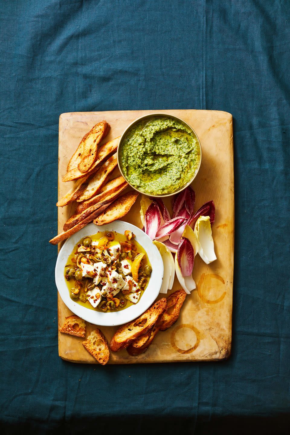 <p>There's no way you'll skip your greens with this creamy dip—it's packed with kale, scallion greens and basil.</p><p><em><a href="https://www.goodhousekeeping.com/food-recipes/a38473895/white-bean-dip-recipe/" rel="nofollow noopener" target="_blank" data-ylk="slk:Get the recipe for Herbed White Bean Dip »;elm:context_link;itc:0;sec:content-canvas" class="link ">Get the recipe for Herbed White Bean Dip »</a></em></p>