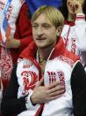 Evgeni Plushenko of Russia gestures as he waits for his results in the men's team short program figure skating competition at the Iceberg Skating Palace during the 2014 Winter Olympics, Thursday, Feb. 6, 2014, in Sochi, Russia. (AP Photo/Darron Cummings, Pool)