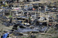 <p>A policeman walks through makeshift tent shelters damaged by strong winds from Typhoon Mangkhut after it barreled across Tuguegarao city in Cagayan province, northeastern Philippines on Sunday, Sept. 16, 2018.<br>Typhoon Mangkhut roared toward densely populated Hong Kong and southern China on Sunday after ravaging across the northern Philippines with ferocious winds and heavy rain causing landslides and collapsed houses.<br>(Photo by Aaron Favila, AP) </p>