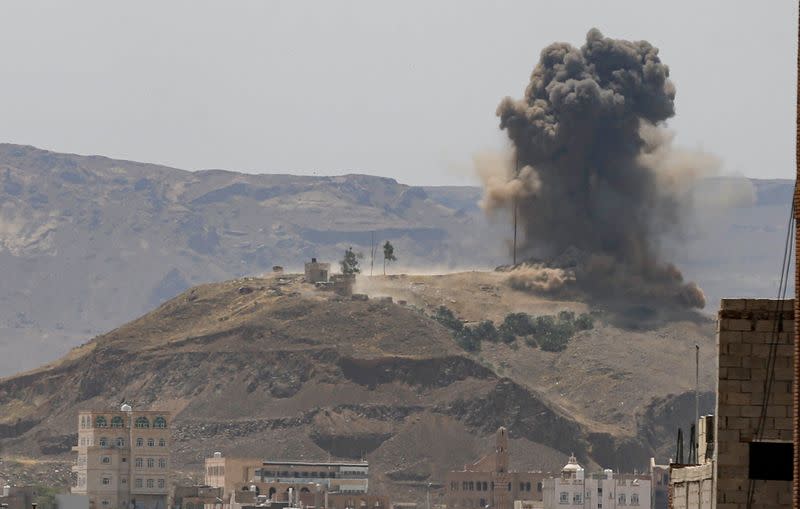 FILE PHOTO: Smoke and dust rise from the site of an air strike on the outskirts of Sanaa