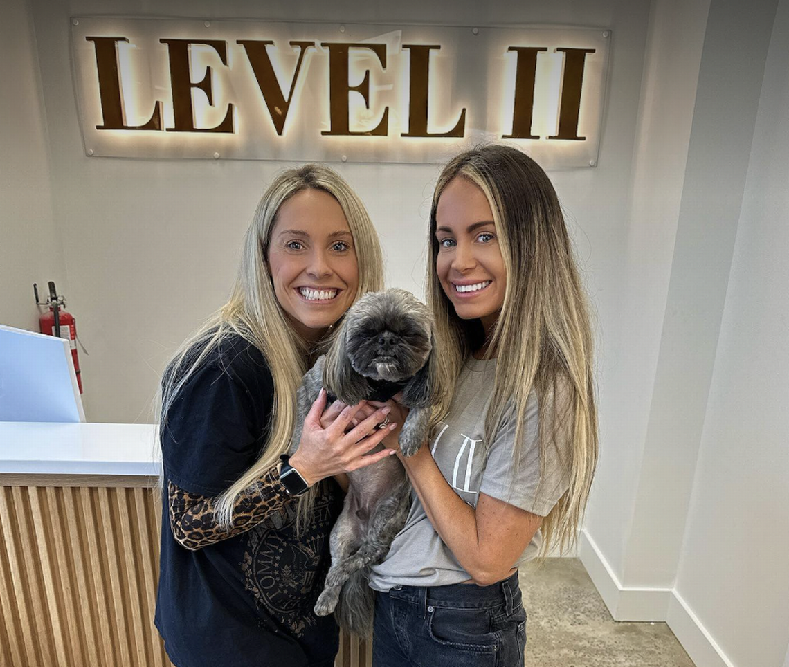 Petey visited Level II in Anderson owned by Seldon Miller, left, and Jessica Tinsley, right. Miller videotaped an interaction between Petey and a groomer, who has since been charged with animal cruelty.