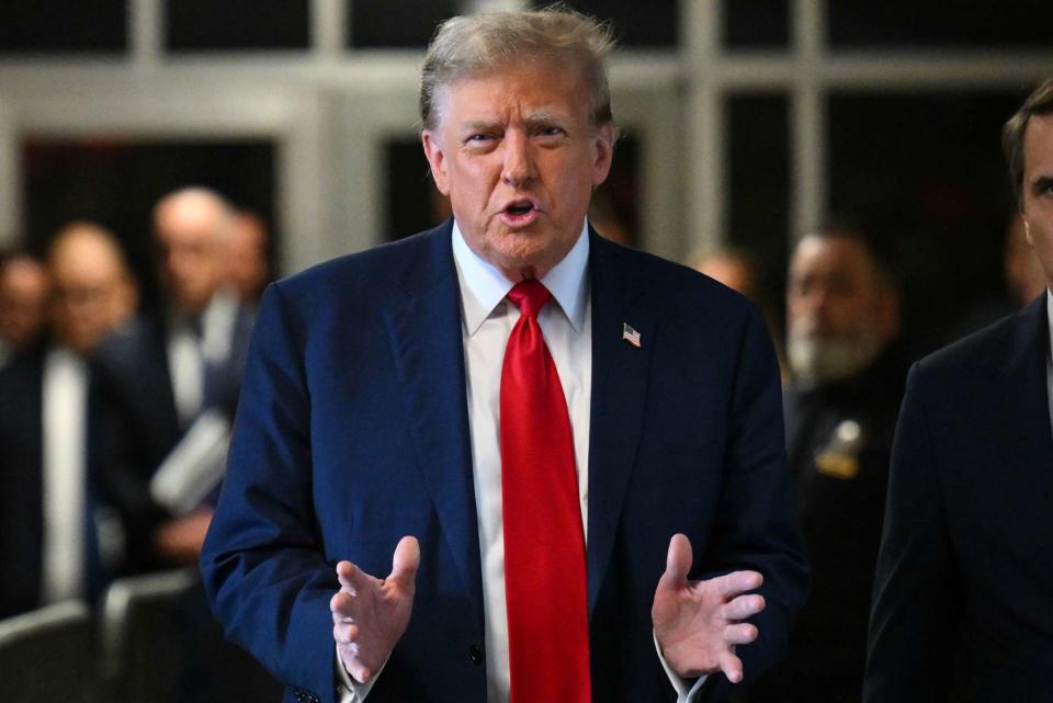 <p>Angela Weiss/AFP/Bloomberg via Getty</p> Former President Donald Trump speaks to reporters before entering a Manhattan courtroom on the first day of his criminal trial