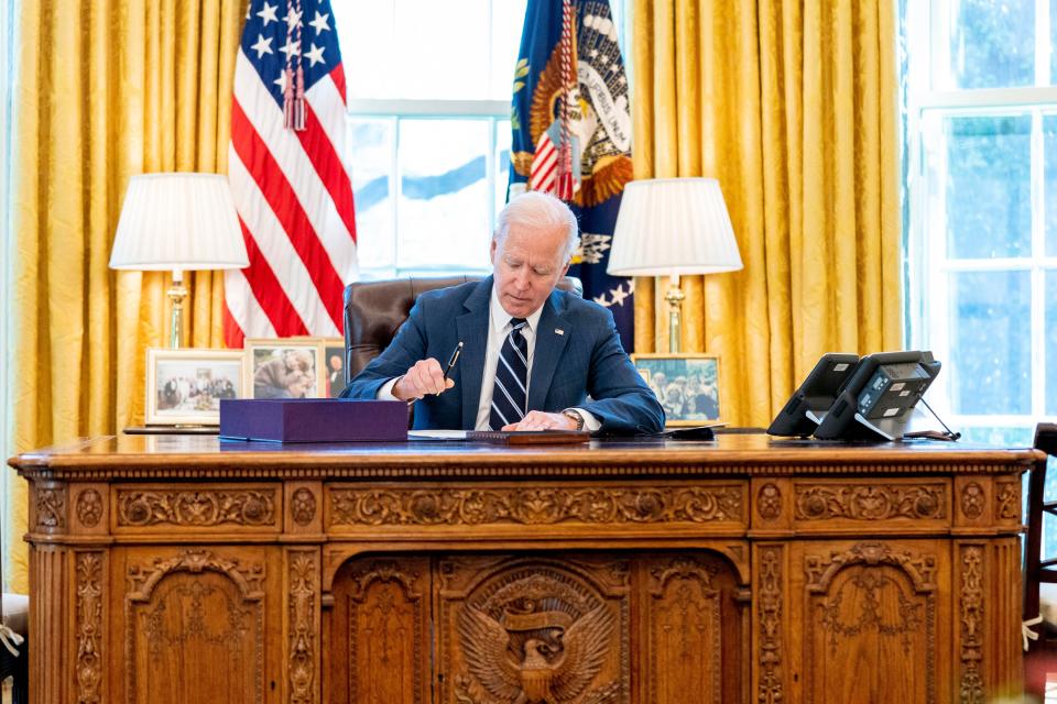 President Joe Biden signs the American Rescue Plan on March 11, 2021, in Washington, D.C.