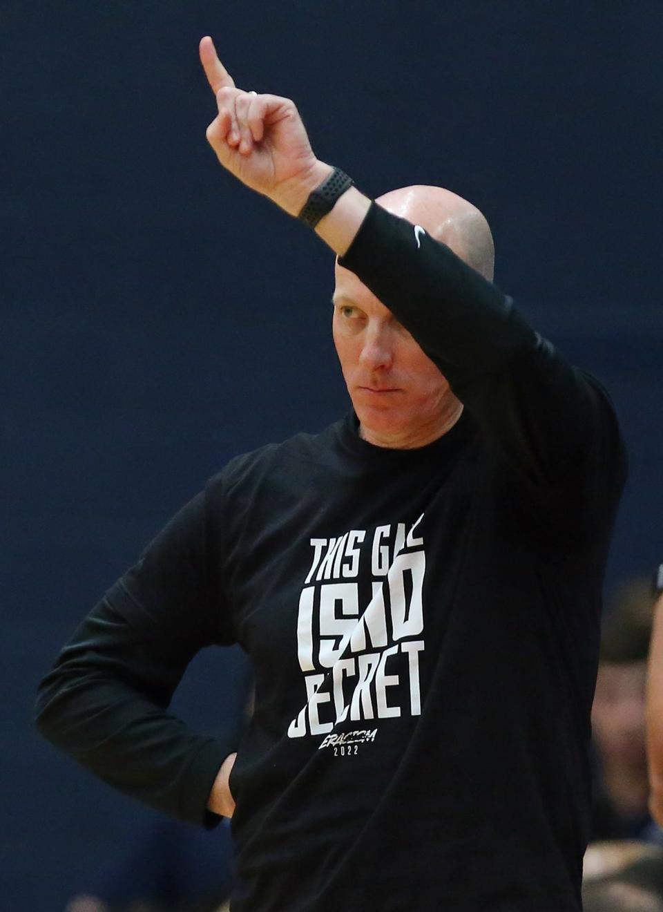 Akron Zips head coach John Groce works the sideline during the first half of an NCAA basketball game against the Miami (Oh) Redhawks, Friday, Feb. 4, 2022, in Akron, Ohio.