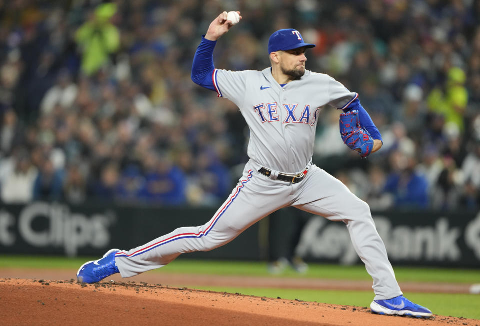 Texas Rangers starting pitcher Nathan Eovaldi throws against the Seattle Mariners during the first inning of a baseball game Friday, Sept. 29, 2023, in Seattle. (AP Photo/Lindsey Wasson)
