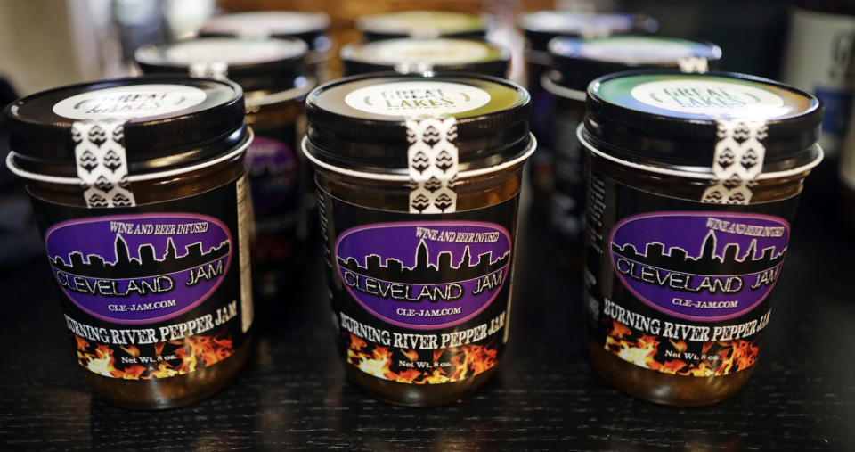 Burning River Pepper Jam is displayed on a shelf at the Great Lakes Brewing Company gift shop, Monday, June 17, 2019, in Cleveland. The "burning river" in the jam's name is inspired by the Cuyahoga River’s most famous fire. (AP Photo/Tony Dejak)