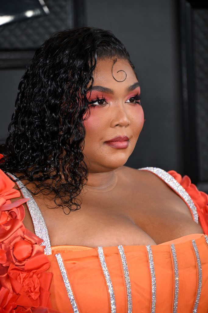 <p>Lizzo makes a case for a monochrome beauty look, wearing a gorgeous shade of red all over her lids, cheeks, and lips. Plus, we're in love with her glossy curls which were crafted by stylist <a href="https://www.instagram.com/theshelbyswain/?hl=en" rel="nofollow noopener" target="_blank" data-ylk="slk:Shelby Swain;elm:context_link;itc:0;sec:content-canvas" class="link ">Shelby Swain</a> using Sebastian Professional styling products. </p><p>"Flushed, diffused cherry cheeks! A fresh approach to this spring color story," her makeup artist <a href="https://www.instagram.com/iwantalexx/?hl=en" rel="nofollow noopener" target="_blank" data-ylk="slk:Alexx Mayo;elm:context_link;itc:0;sec:content-canvas" class="link ">Alexx Mayo</a> says in a statement. "Using Charlotte Tilbury’s new Pillow Talk Matte Beauty Blush Wand in Dream Pop on top of the high planes of the face and blended into the eye for an extra pop. Bold, daring and ready for anything.”</p><p><a class="link " href="https://go.redirectingat.com?id=74968X1596630&url=https%3A%2F%2Fwww.charlottetilbury.com%2Fus%2Fproduct%2Fmatte-beauty-blush-wand-dream-pop&sref=https%3A%2F%2Fwww.harpersbazaar.com%2Fbeauty%2Fmakeup%2Fg42672602%2Fbest-hair-makeup-beauty-grammys-2023%2F" rel="nofollow noopener" target="_blank" data-ylk="slk:Shop Now;elm:context_link;itc:0;sec:content-canvas">Shop Now</a></p>