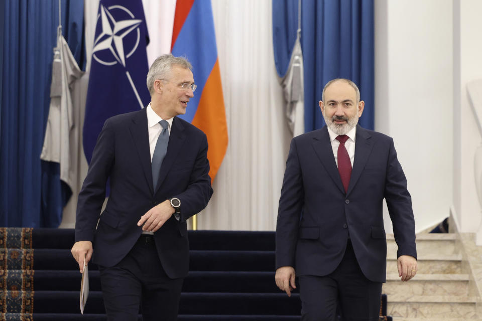 Armenia's Prime Minister Nikol Pashinyan, right, and NATO Secretary General Jens Stoltenberg walk to make joint statements after their meeting in Yerevan, Armenia, Tuesday, March 19, 2024. (Stepan Poghosyan/Photolure via AP)