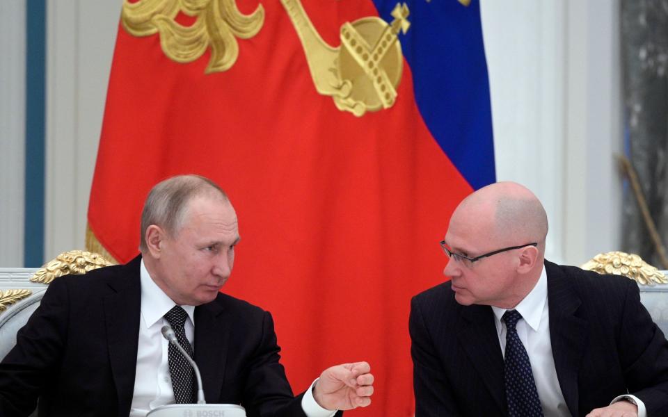 MANDATORY CREDIT Mandatory Credit: Photo by ALEXEI DRUZHININ/SPUTNIK/KRE/EPA-EFE/Shutterstock (10955377a) (FILE) - Russian President Vladimir Putin (L) talks to First Deputy Chief of Staff of the Presidential Office Sergei Kiriyenko (R) during a meeting with members of the working group on proposals for amendments to the Russian constitution, in Moscow, Russia, 26 February 2020 (reissued 15 October 2020). The European Union puts Director of Russia's FSB Alexander Bortnikov, First Deputy Chief of Staff of the Presidential Administration Sergei Kiriyenko and four other high-ranking Russian officials on the EU's blacklist against Russia over the alleged poisoning of blogger Alexey Navalny, the Council of the European Union said. EU sanctions on Russian high-ranked officials over Navalny poisoning, Moscow, Russian Federation - 26 Feb 2020 - ALEXEI DRUZHININ/SPUTNIK/KRE/EPA-EFE/Shutterstock
