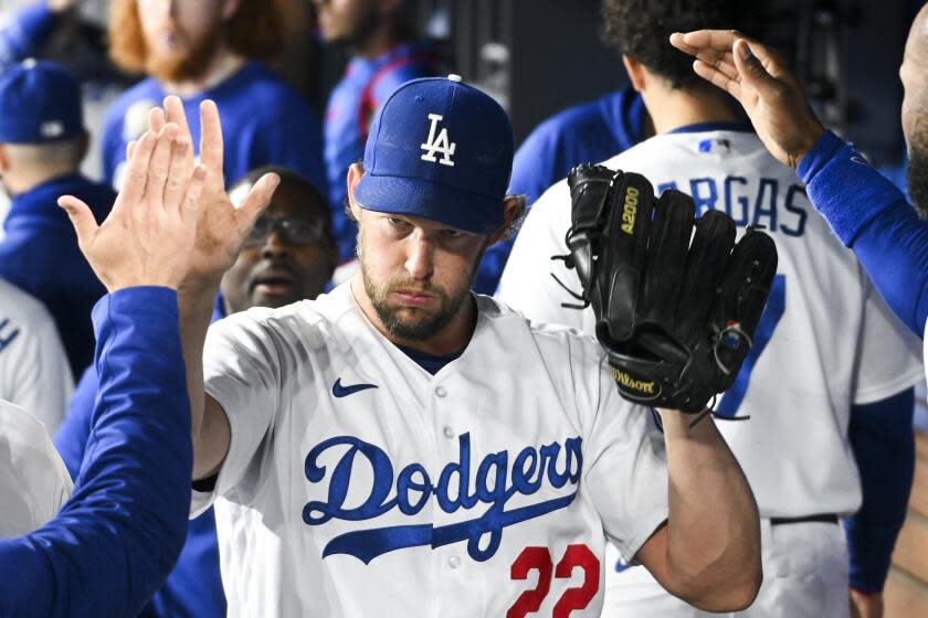 Los Angeles, CA - April 18: Los Angeles Dodgers starting pitcher Clayton Kershaw (22) greets the dugout.