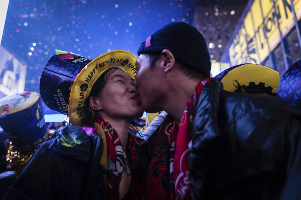 A couple kisses after the Times Square New Year's Ball drops during the New Year's celebration in Times Square, early Sunday, Jan. 1, 2023, in New York. (AP Photo/Stefan Jeremiah)
