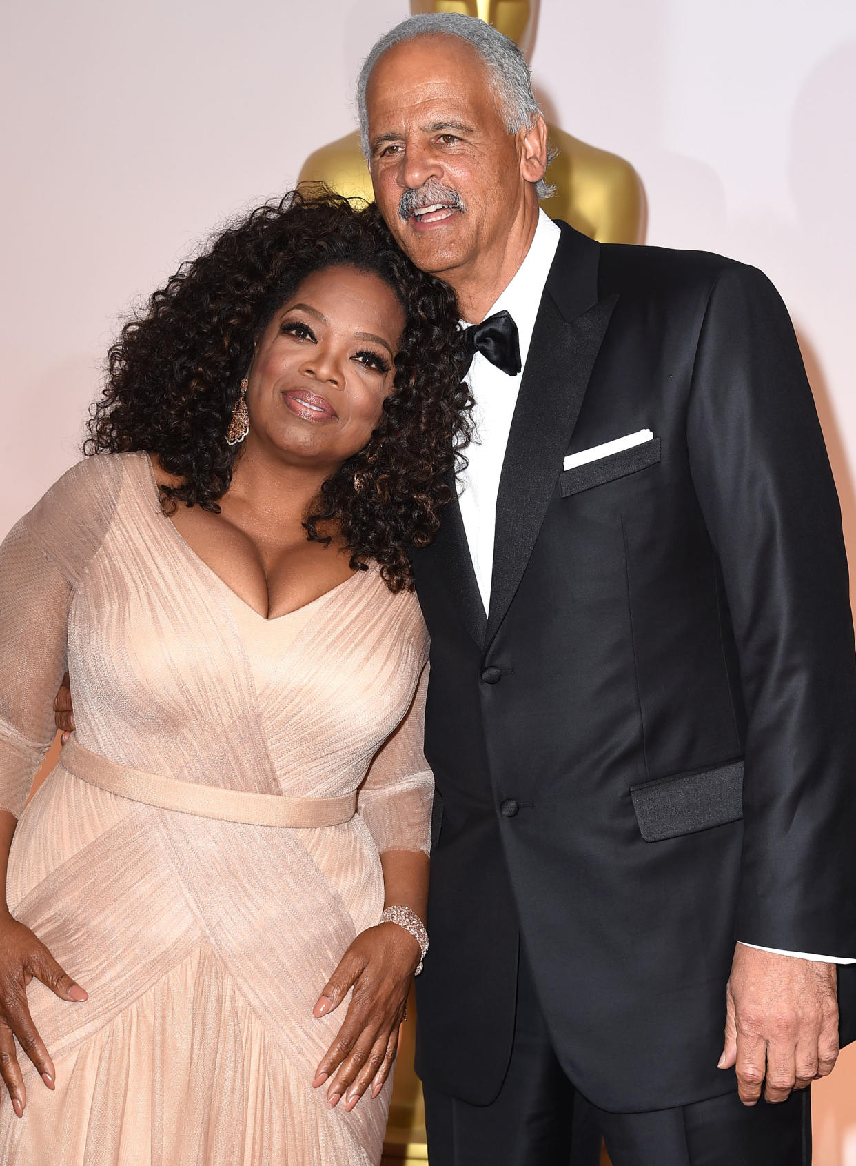 Oprah Winfrey and Stedman Graham smile as they arrive at the Vanity Fair Oscar party in 2015, but that isn’t good tabloid material. They look too happy! (Photo: Steve Granitz/WireImage)