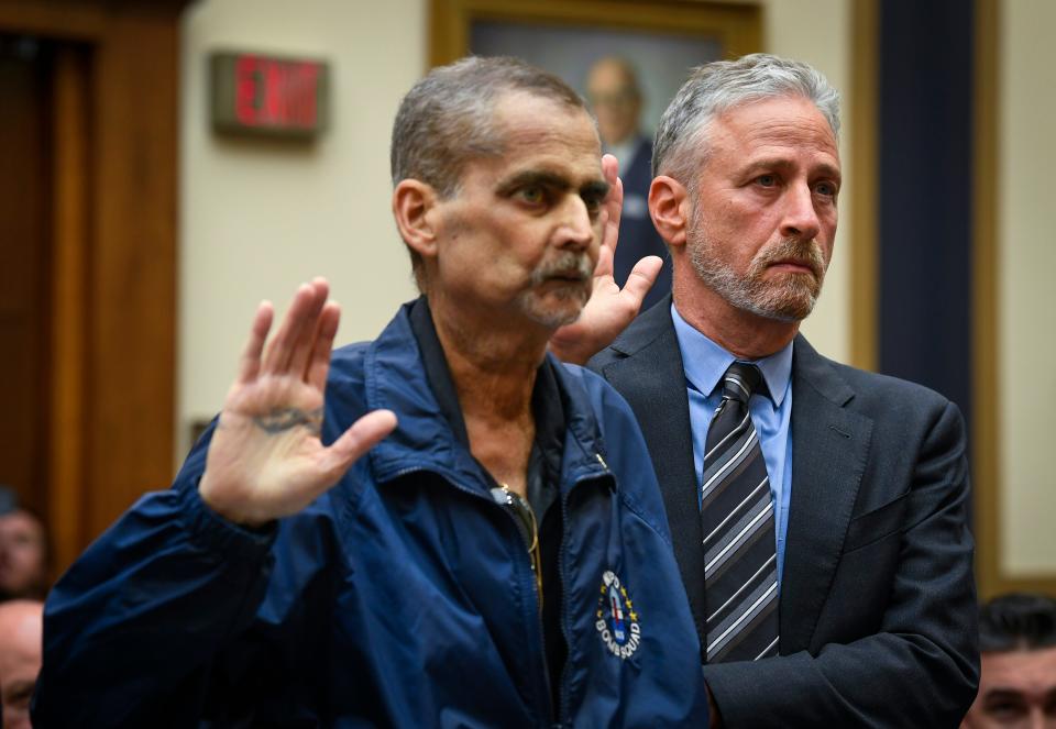 6/11/19 10:44:46 AM -- Washington, DC, U.S.A  -- Jon Stewart helps Luis Alvarez, Detective (Ret.) and 9/11 Responder, New York Police Department, as they are sworn before testimony in front of the House Judiciary Committee on the need to reauthorize the September 11th Victim Compensation Fund on June 11, 2019 in Washington.   --    Photo by Jack Gruber, USA TODAY Staff ORG XMIT:  JG 138068 Jon Stewart Cong 6/11 (Via OlyDrop)