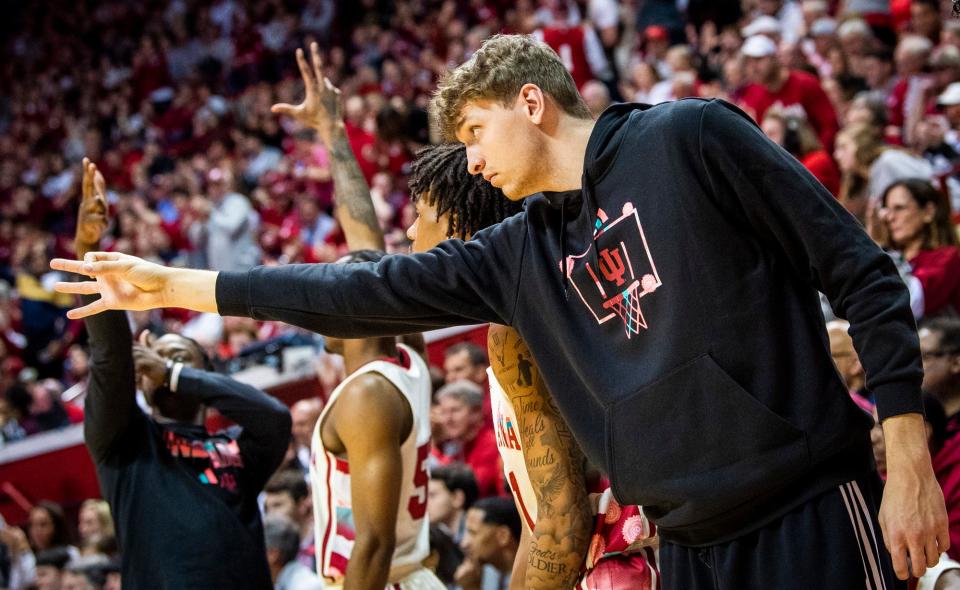 Indiana's Logan Duncomb (51) and the Indiana bench celebrate a Miller Kopp three-pointer during the second half of the Indiana versus Rutgers men's basketball game at Simon Skjodt Assembly Hall on Tuesday, Feb. 7, 2023.