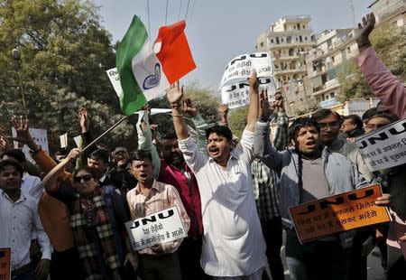 Activists from various Hindu right-wing groups shout slogans during a protest against the students of Jawaharlal Nehru University (JNU) outside the university campus in New Delhi, India, February 16, 2016. REUTERS/Anindito Mukherjee