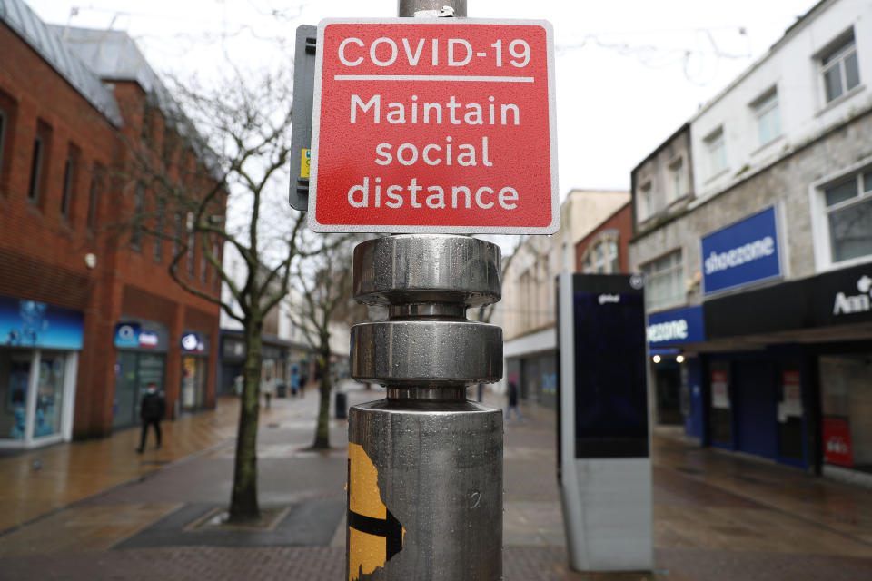 A Covid-19 social distancing sign on Commercial road in Portsmouth during England's third national lockdown to curb the spread of coronavirus. (Photo by Andrew Matthews/PA Images via Getty Images)