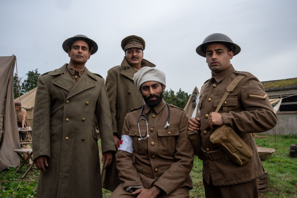 (L to R) Actors Shammi Aulakh, Jack Gill, Rishi Rian and Ali Afzal, portraying Captain Anis Khan, Major Akbar Khan, Medic Saddiq Khan, and Corporal Chaudry Wali Mohammed, respectively, pose for a group portrait outdoors while filming a WW2 historic reenactment production for "Erased: WW2's Heroes of Color." They were members of Force K6, a little-known Indian regiment of mule handlers in WW2. Amidst the chaos of Dunkirk and the advancing German Army, the Indian regiment fought for victory and independence. (National Geographic/Harriet<br>Laws Herd)