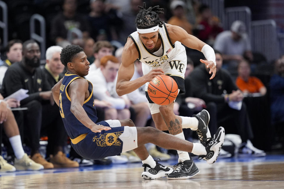 Notre Dame guard Markus Burton (3) collides with Wake Forest guard Hunter Sallis (23) during the second half of the Atlantic Coast Conference second round NCAA college basketball tournament game Wednesday, March 13, 2024, in Washington. (AP Photo/Susan Walsh)