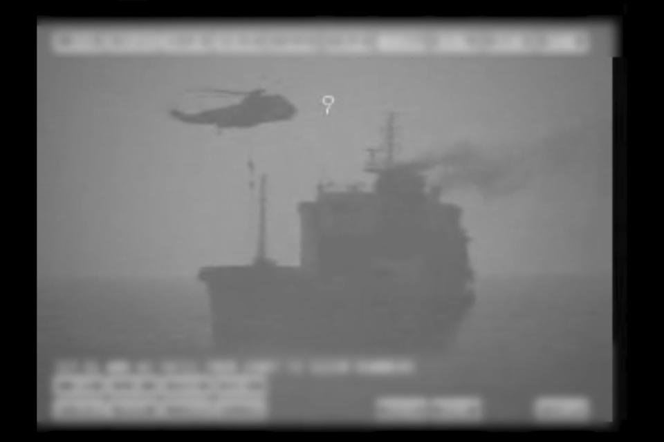 In this image made from video released by the U.S. military's Central Command, Iranian commandos fast-rope down from a helicopter onto the MV Wila oil tanker in the Gulf of Oman off the coast of the United Arab Emirates on Wednesday, Aug. 12, 2020. The Iranian navy boarded and briefly seized the Liberian-flagged oil tanker near the strategic Strait of Hormuz amid heightened tensions between Tehran and the U.S., a U.S. military official said Thursday, Aug. 13, 2020. (U.S. military's Central Command via AP)