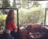 Celebrity photos: Kelly Brook tweeted this image of herself cooking a spitroast for some friends over the weekend. Later on, she said: “What a day! Beautiful friends and Yummy food x.”