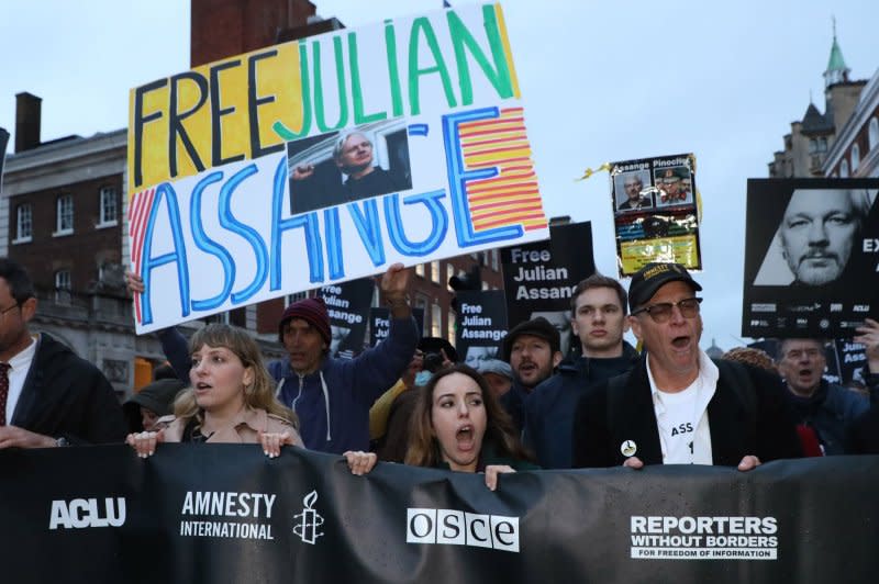 Supporters of Julian Assange march against his extradition to the United States at the Royal Courts of Justice in London on Wednesday. The two day hearing in front of a judge is the last chance for Julian Assange to gain an appeal to stop his extradition. Photo by Hugo Philpott/UPI