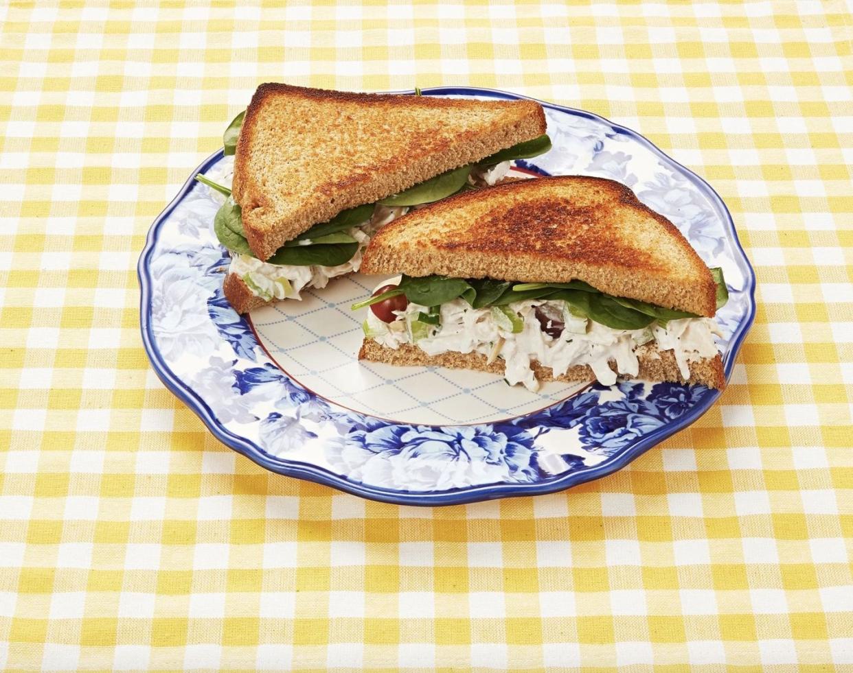 chicken salad sandwich on blue plate