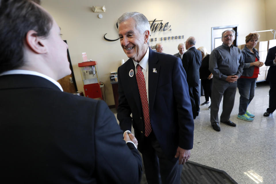 Louisiana's Republican gubernatorial candidate Eddie Rispone greets supporters and talks to media on a campaign stop at New Orleans International Airport in Kenner, La., Monday, Nov. 4, 2019. Rispone says a radio ad linking him and President Donald Trump to former Ku Klux Klan leader David Duke is "disgusting." Rispone is blaming Democratic incumbent John Bel Edwards for the advertising by the New Orleans-based Black Organization for Leadership Development. There's no evidence Edwards is connected to the effort. (AP Photo/Gerald Herbert)