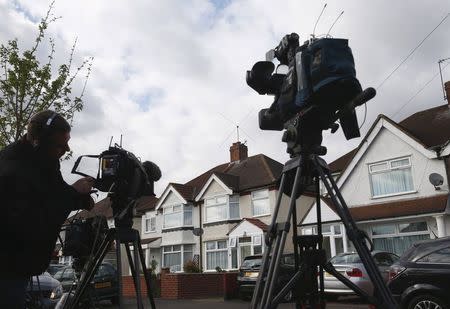 Television crews wait outside the address where Nav Sarao Futures Limited is registered, in Hounslow, west London April 22, 2015. REUTERS/Eddie Keogh