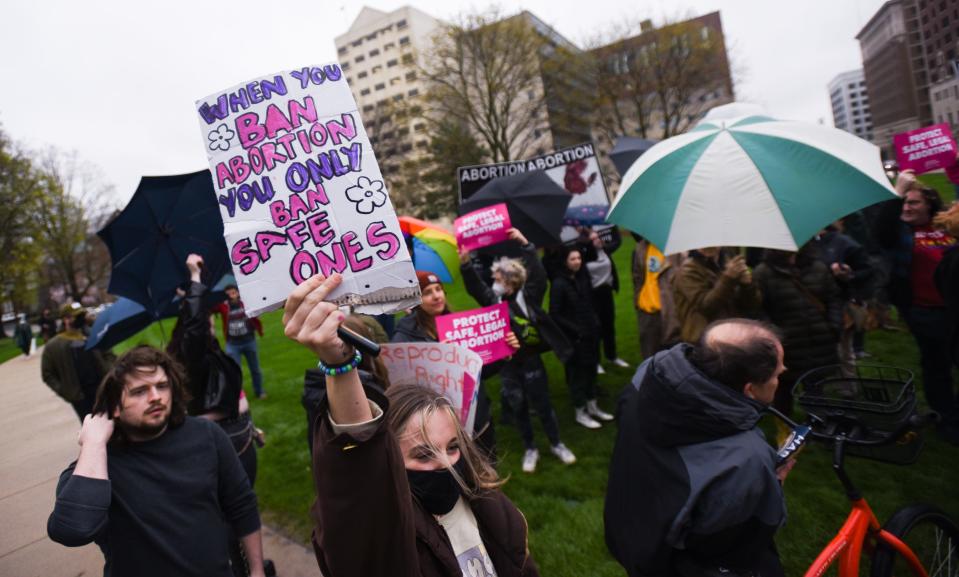 People rally at the state Capitol in Lansing, Mich., Tuesday, May 2, 2022, in support of abortion rights after a draft of the U.S. Supreme Court opinion was leaked in favor of overturning Roe v. Wade.  [AP Photo/Matthew Dae Smith via Lansing State Journal]