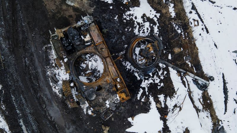 A charred Russian tank is seen in the Sumy region.