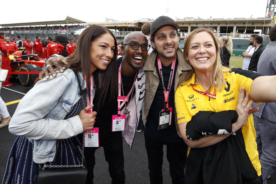 Tania Nell, Mo Farah and Dynamo (left to right) during the British Grand Prix at Silverstone, Towcester. (Photo by Martin Rickett/PA Images via Getty Images)