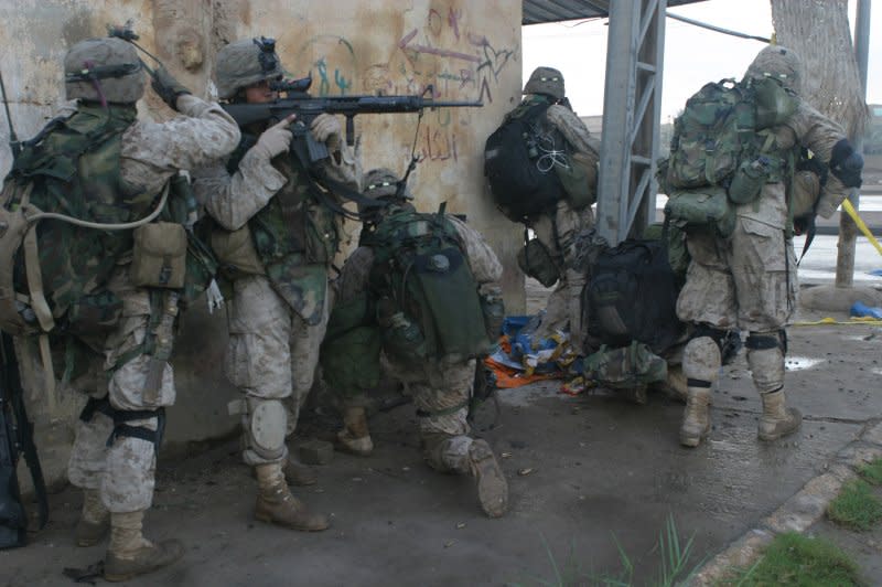 U.S. Marines of RCT-7 and the Emergency Response Unit of the Iraqi Forces perform offensive operations on November 10, 2004 during fighting in Fallujah, Iraq. On November 13, 2004, an Iraqi national security adviser said up to 1,000 insurgents were killed in a six-day battle for Fallujah. File Photo by SSgt J. Knauth/USMC