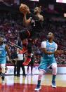 Dec 13, 2017; Houston, TX, USA; Houston Rockets guard Chris Paul (3) goes up for a shot ahead of Charlotte Hornets guard Kemba Walker (15) during the second quarter at Toyota Center. Shanna Lockwood-USA TODAY Sports