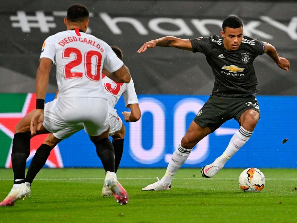 Mason Greenwood on the ball for United against Sevilla: Getty