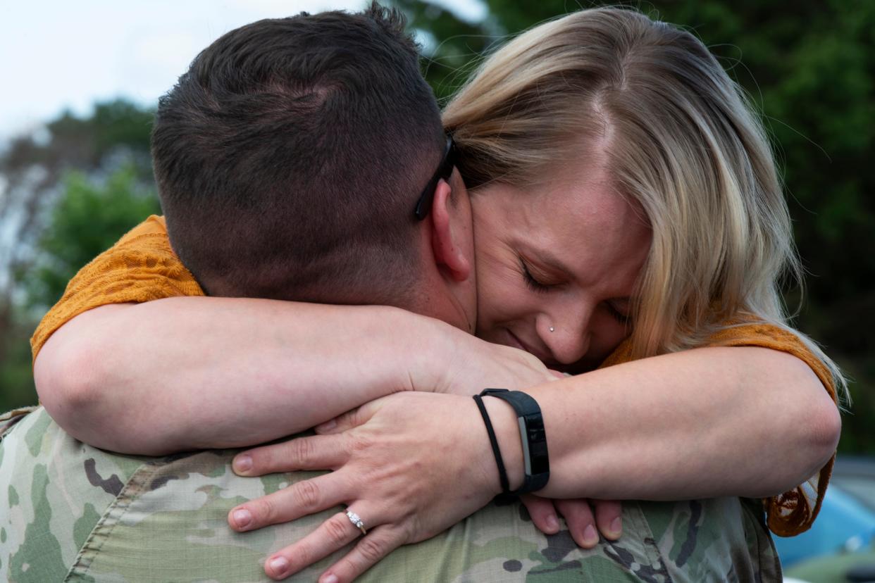 Savannah Saddler hugs her fiancé, Staff Sgt. Ray Carney of Cedar Lake, Ind., at Atlantic Aviation in South Bend where 60 soldiers from the Indiana National Guard 76th Infantry Brigade Combat Team are welcomed from their deployment in Kosovo, on Thursday, July 13, 2023.