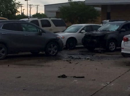 Debris remains where an explosive ordnance robot attempted to move a bag, outside the Dallas Police Department in Dallas, Texas, in this handout photo released by the Dallas Police Department on June 13, 2015. REUTERS/Dallas Police Department/Handout via Reuters