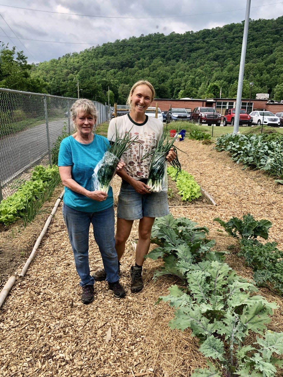 Pictured are Natalie Hesed, Hot Springs Garden Club coordinator, alongside Kathy, a regular attendee at the garden club's Gather and Garden Days, which "are more focused around coming together and building social relationships, as well as doing work in the garden," according to Hesed.