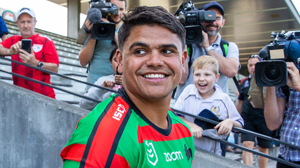 Latrell Mitchell smiles in a Rabbitohs jersey.