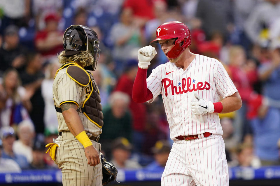 Philadelphia Phillies' Rhys Hoskins, right, reacts after hitting a home run against San Diego Padres pitcher Blake Snell during the third inning of a baseball game, Wednesday, May 18, 2022, in Philadelphia. (AP Photo/Matt Slocum)