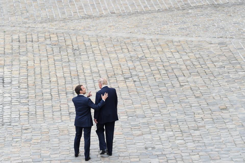 Trump is welcomed by French President Emmanuel Macron during a welcome ceremony at Les Invalides in Paris.